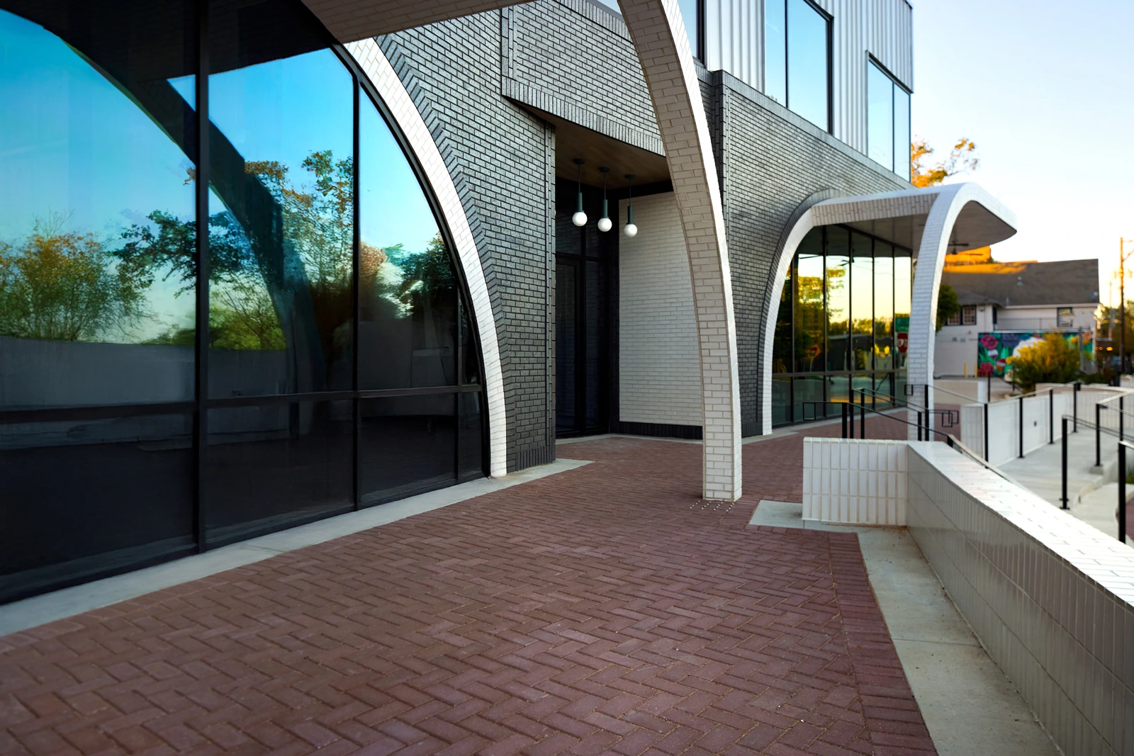 Exterior view of 1023 Studewood front patio, a modern mixed-use commercial building in The Heights, Houston TX featuring retail and office leasing opportunities with rooftop terrace and dedicated parking.