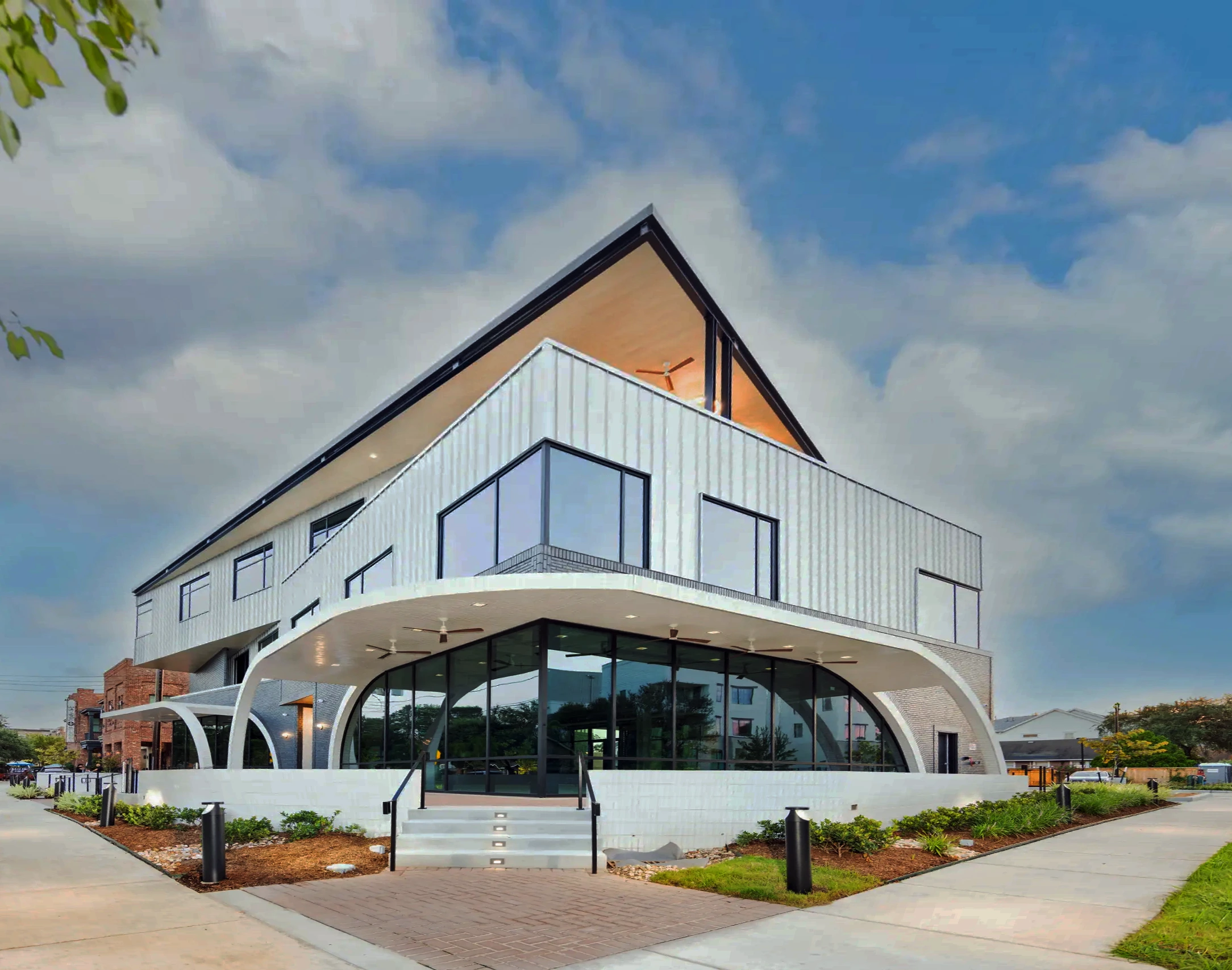 Exterior view of 1023 Studewood, a modern Class A commercial building in The Heights, Houston featuring office and retail space for lease with rooftop terrace access.